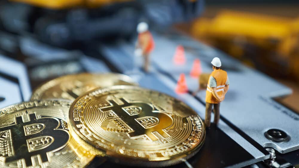 miniature Excavator and Bitcoin coins